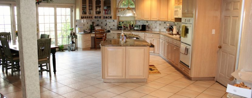 A Kitchen With White Tiled Flooring